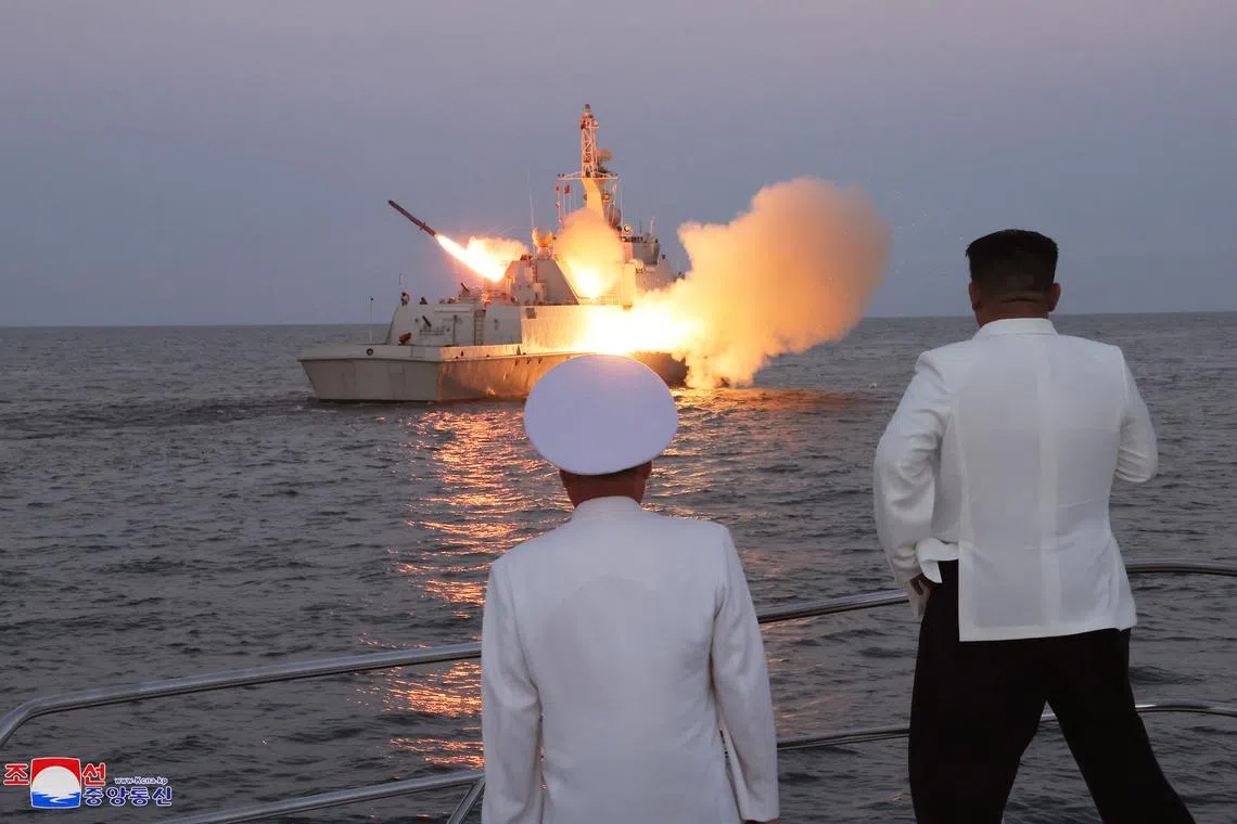 An undated photo released by the official North Korean Central News Agency (KCNA) on August 21, 2023 shows North Korean leader Kim Jong Un (R) inspecting a flotilla of the East Sea Fleet of the Navy of the Korean People's Army (KPA) in North Korea.  