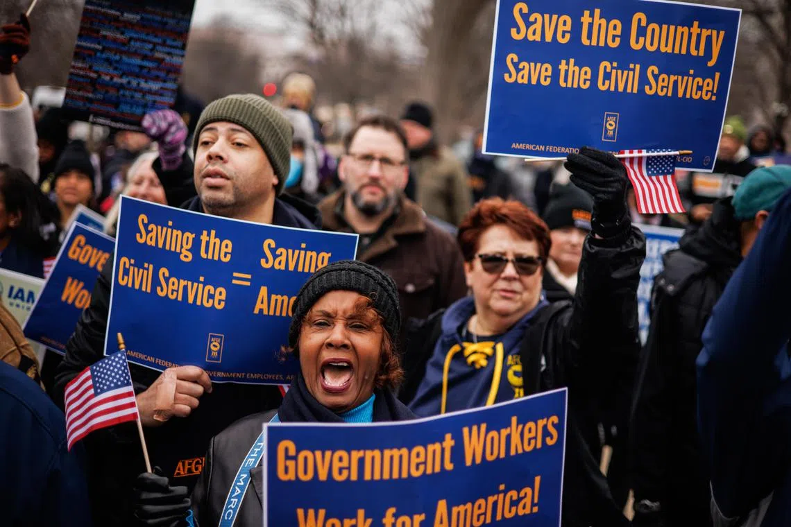Members of the American Federation of Government Employees rally outside the US Capitol building in Washington, on Feb 11, 2025.