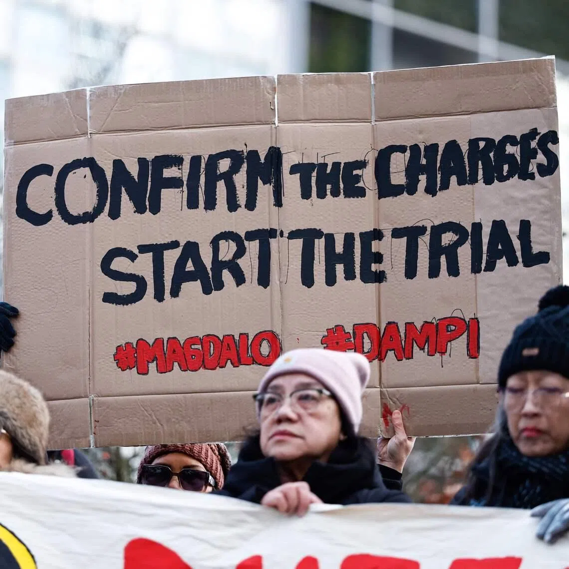 People demonstrate in favour of the detention of former Philippines president Rodrigo Duterte outside the International Criminal Court on Feb 23.