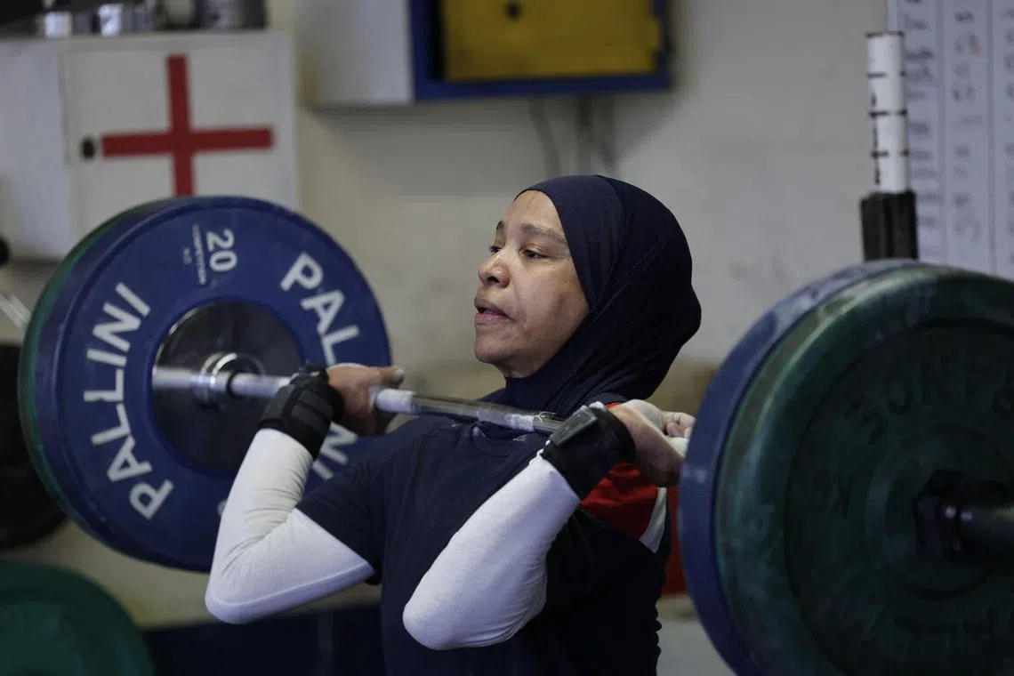French weightlifting champion Sylvie Eberena training in Mantes-la-Jolie, on the outskirts of Paris, on March 26, 2025. But now the Muslim convert fears she will no longer be able to compete as the French government is pushing for a new law to ban the headscarf in domestic sports competitions.