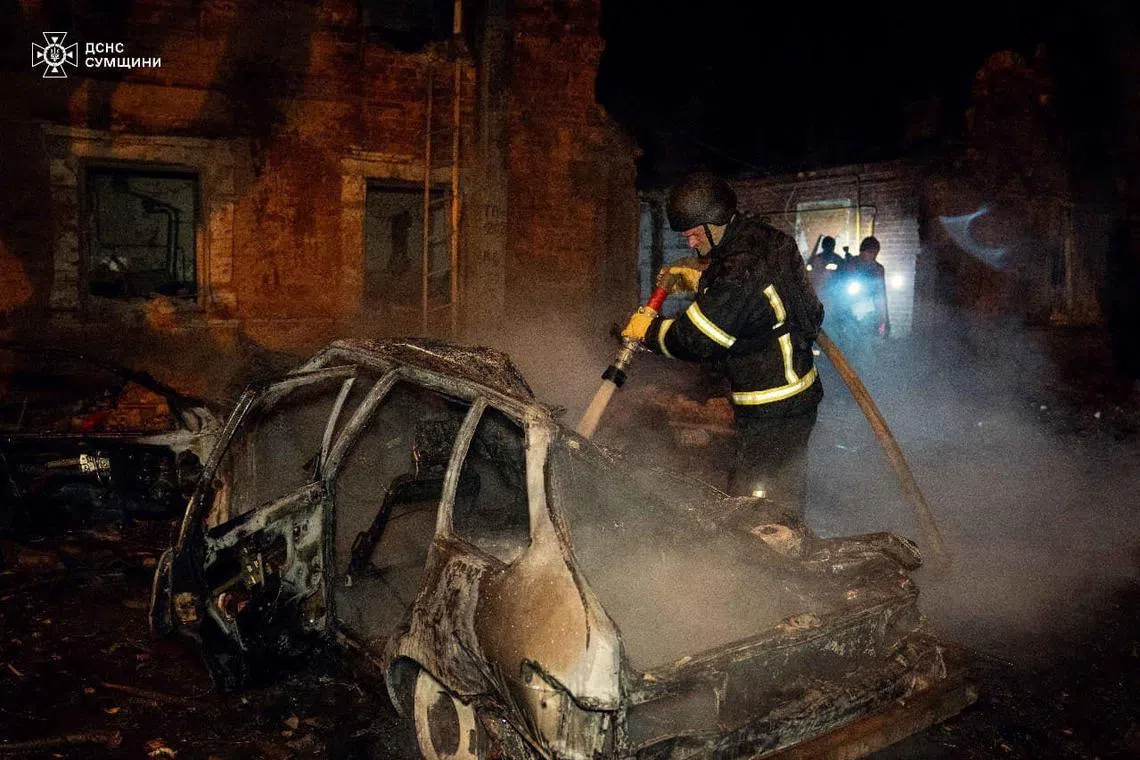 Firefighters work at a site of a residential area hit by a Russian drone strike, amid Russia's attack on Ukraine, in Sumy, Ukraine November 22, 2024. Press service of the State Emergency Service of Ukraine in Sumy region/Handout via REUTERS