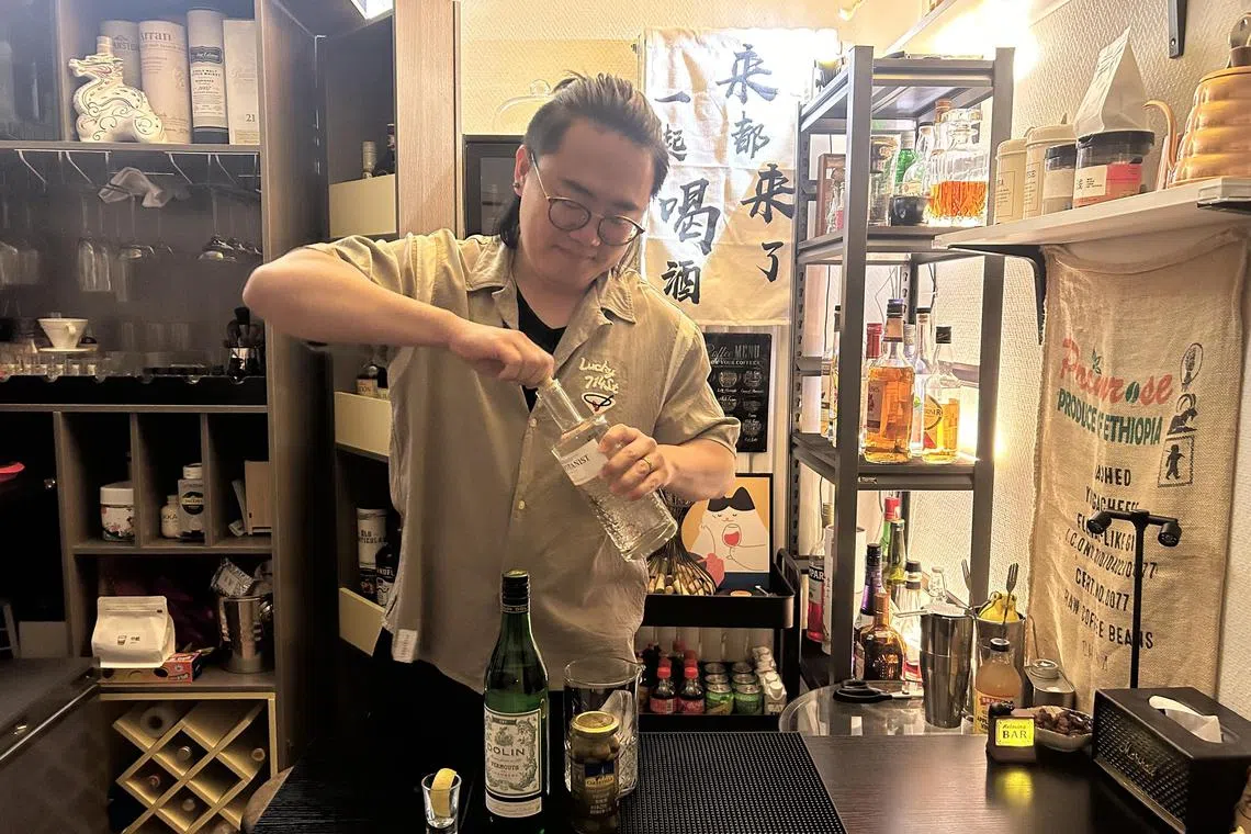awletter23 - In Beijing, Mr Ken Yang, 32, has converted the living room of his one-bedroom apartment, whom he shares with his girlfriend, into a cosy bar, complete with shelves of alcohol, a freezer and mood lighting.
