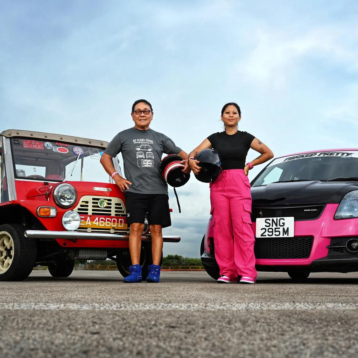 From left: The oldest participant, Eric Tiong, 76 with his 1972 Mini Moke and gymkhana rookie Shahfini Binte Saeful Mawar, 30 with her pink Suzuki Swift Sport at Changi Exhibition Centre during Sprint Fest Tryouts on May 24, 2025.