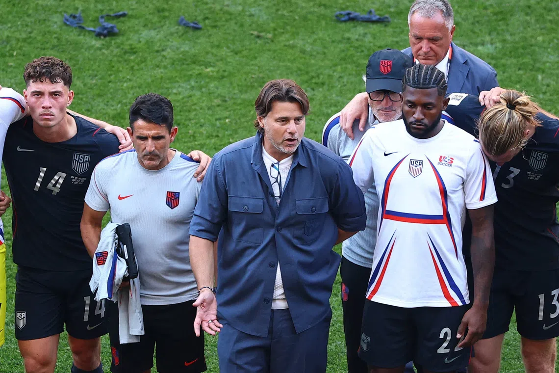 Soccer Football - FIFA World Cup 2026 - Round of 16 - United States v Belgium - Seattle Stadium, Seattle, Washington, U.S. - July 6, 2026 U.S. coach Mauricio Pochettino speaks to the team after the match as the U.S. are eliminated from the World Cup REUTERS/Agustin Marcarian