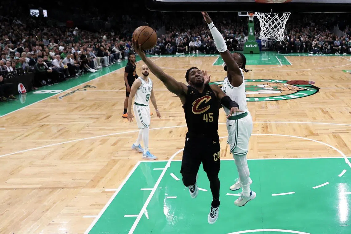 Donovan Mitchell of the Cleveland Cavaliers shoots the ball against Jaylen Brown of the Boston Celtics during the first half in Game 2 of the NBA Eastern Conference semi-final play-offs.