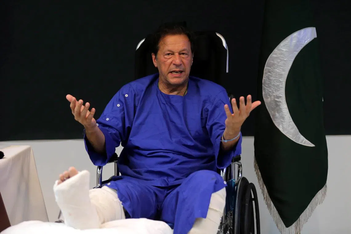 Pakistan's former PM Imran Khan talks with journalists at Shaukat Khanum hospital in Lahore, Pakistan, on Nov 4, 2022. 