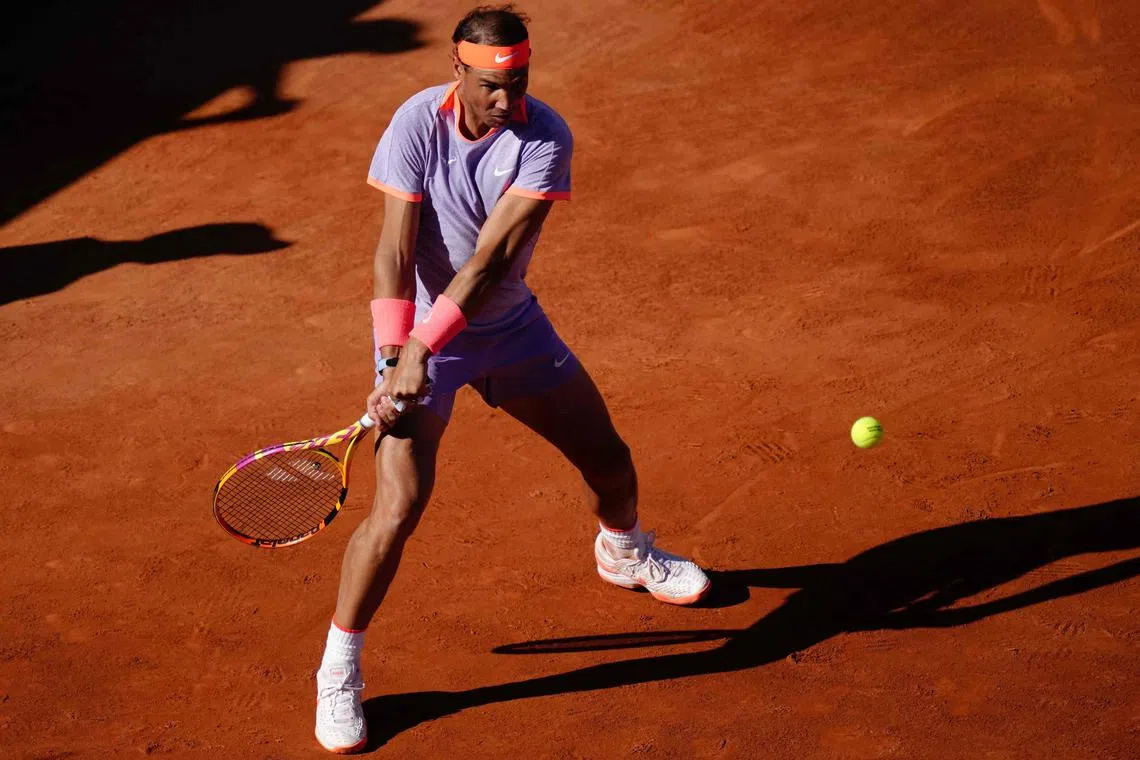 Spain's Rafael Nadal returns the ball to Italy's Flavio Cobolli during the Barcelona Open.
