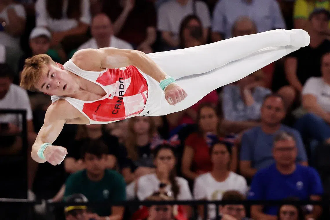Gymnastics-Canada's Dolci gets second chance on bar after equipment ...