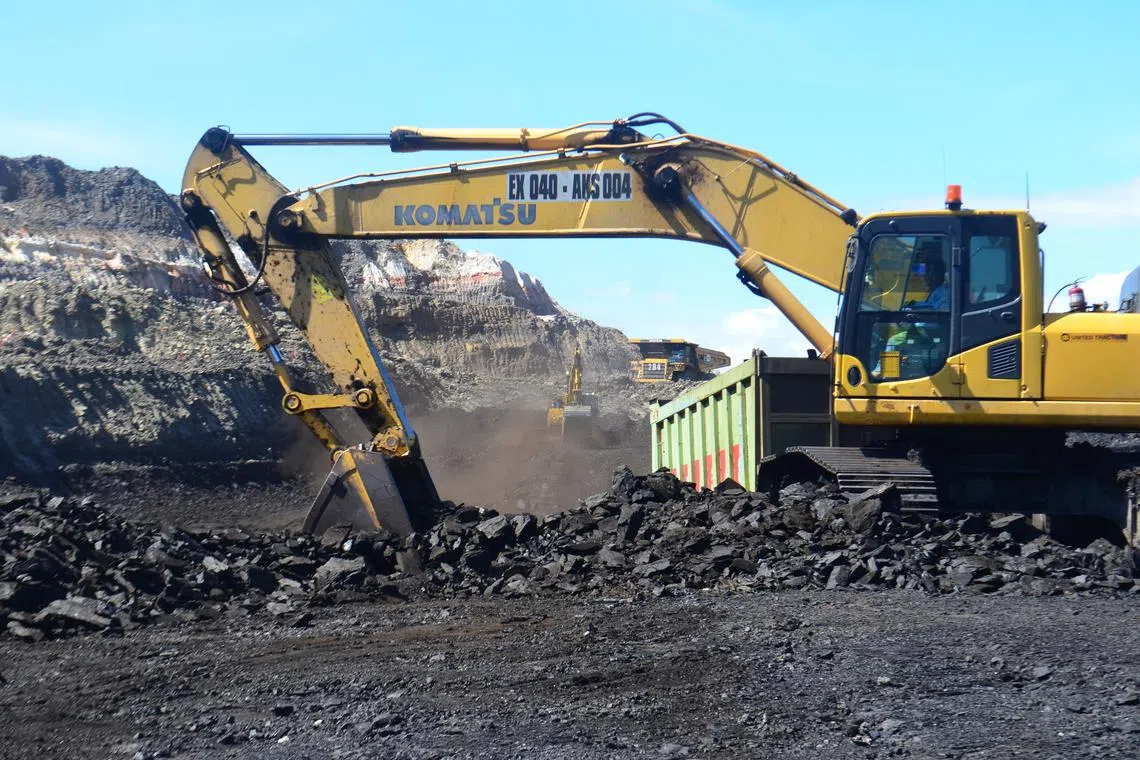 Excavators at work in Golden Energy and Resources' BIB mine in South Kalimantan.