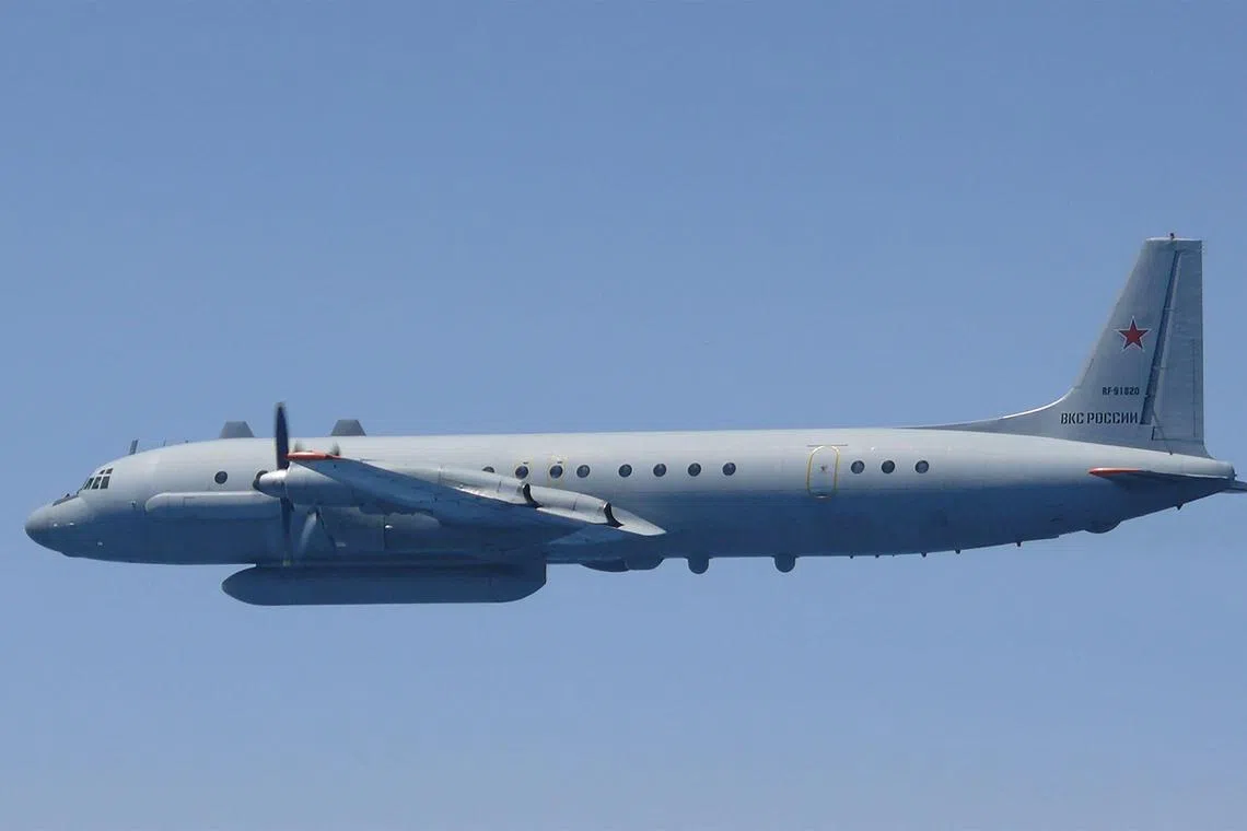 This handout photo taken and received on May 25, 2023 from Japan's Ministry of Defense shows a Russian Ilyushin IL-20 aircraft in the air off the west coast of Japan. Japan scrambled fighter jets on May 25 after Russian "intelligence-gathering" aircrafts were detected off its coasts along the Pacific Ocean and Sea of Japan, the country's Joint Staff said. (Photo by Handout / Japan's Ministry of Defense / AFP) / -----EDITORS NOTE --- RESTRICTED TO EDITORIAL USE - MANDATORY CREDIT "AFP PHOTO / Ministry of Defense" - NO MARKETING - NO ADVERTISING CAMPAIGNS - DISTRIBUTED AS A SERVICE TO CLIENTS