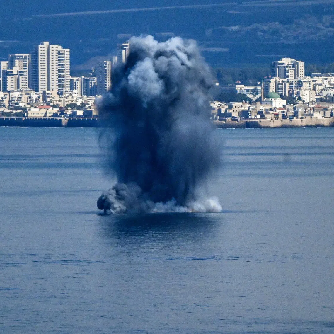 An explosion in the sea, after missiles were launched towards Israel from Iran following strikes by Israel and the U.S. on Iran, as seen from Haifa, northern Israel, February 28, 2026. REUTERS/Rami Shlush