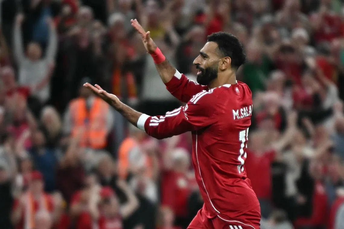 Liverpool striker Mohamed Salah celebrates after scoring their fourth goal.
