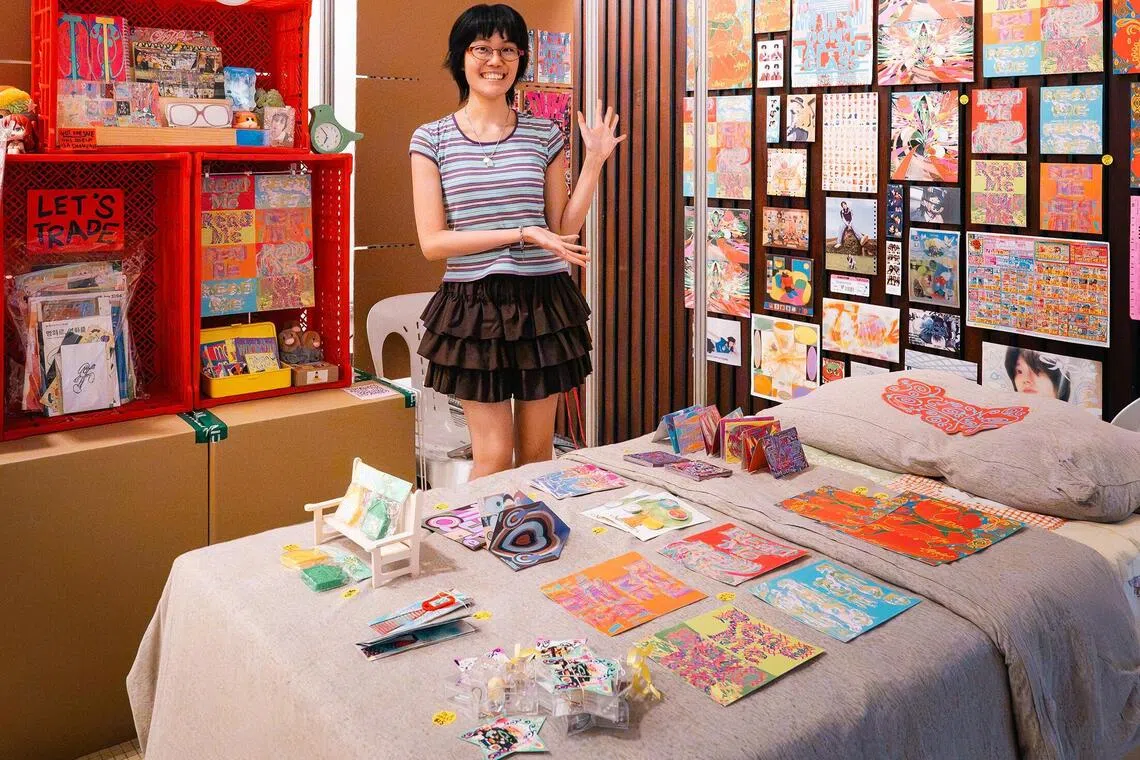 Designer Claire Boon makes a cardboard bed for her booth at In-Between.