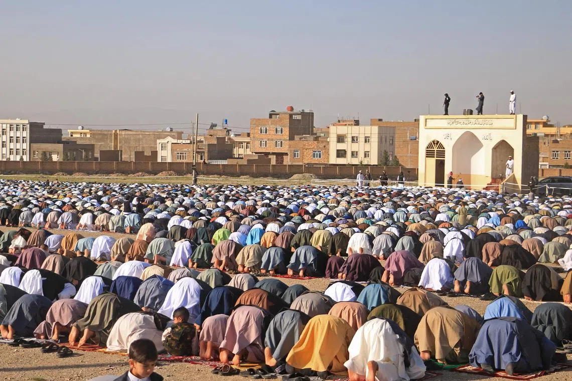 Muslim devotees offer Eid al-Fitr prayers, which marks the end of the holy fasting month of Ramadan at the Guzargah mosque in Herat on April 10, 2024. 