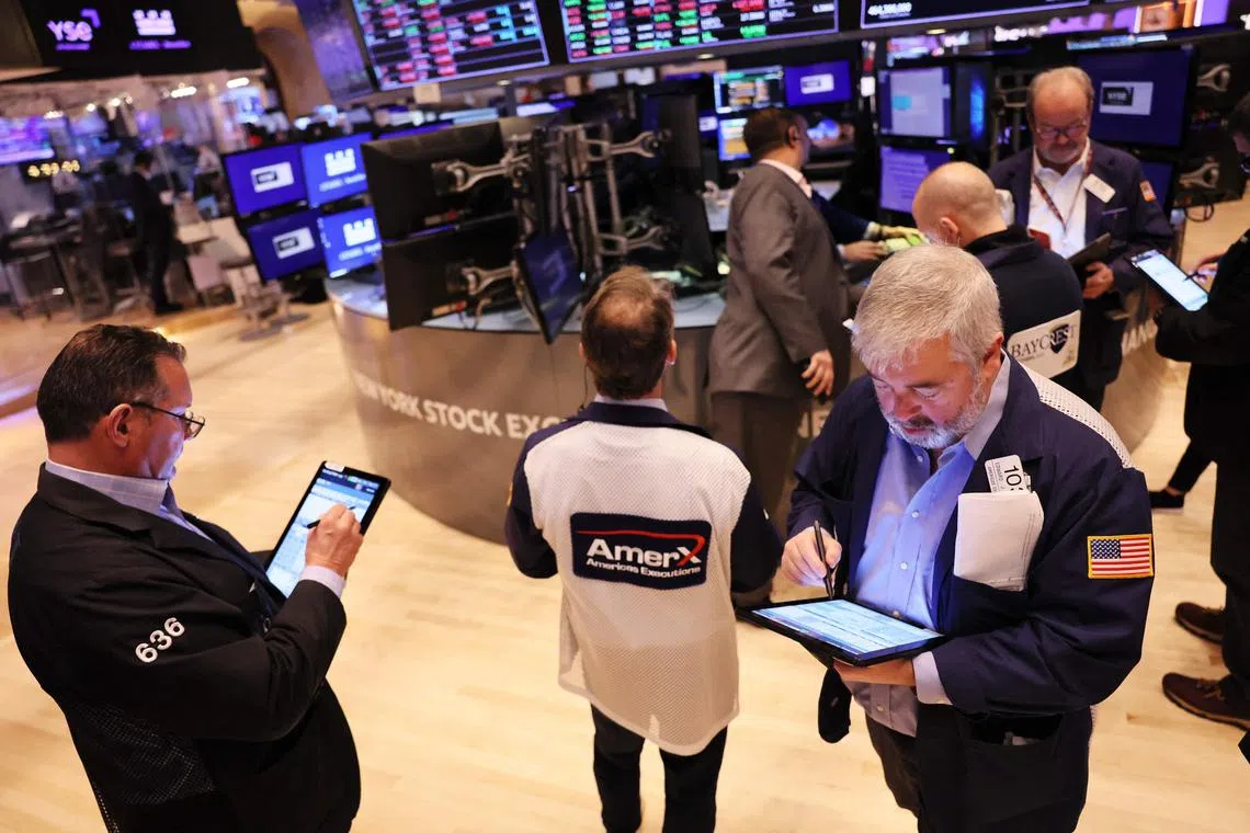 Traders work on the floor of the New York Stock Exchange, during morning trading, on Jan 19, 2023.