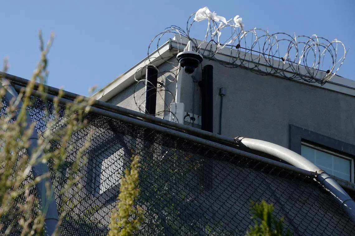 FILE PHOTO: A surveillance camera sits outside of Delaney Hall, a 1,000-person detention center operated by private prison company GEO Group for Immigration and Customs Enforcement (ICE), in the Ironbound neighborhood of Newark, New Jersey, U.S., May 10, 2025.  REUTERS/Bing Guan/File Photo