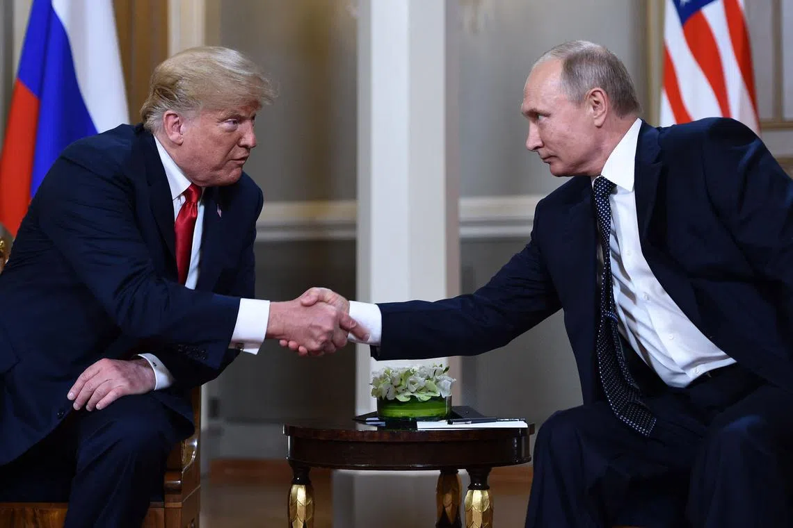 TOPSHOT - (FILES) Russian President Vladimir Putin (R) and US President Donald Trump shake hands before a meeting in Helsinki, on July 16, 2018. US President Donald Trump and Russian counterpart Vladimir Putin could meet for a summit as early as next week, the Kremlin said on August 7, 2025. The meeting would be the first between a sitting US and Russian president since Joe Biden met Putin in Geneva in June 2021, and comes as Trump seeks to broker an end to Russia's military assault on Ukraine. (Photo by Brendan Smialowski / AFP)