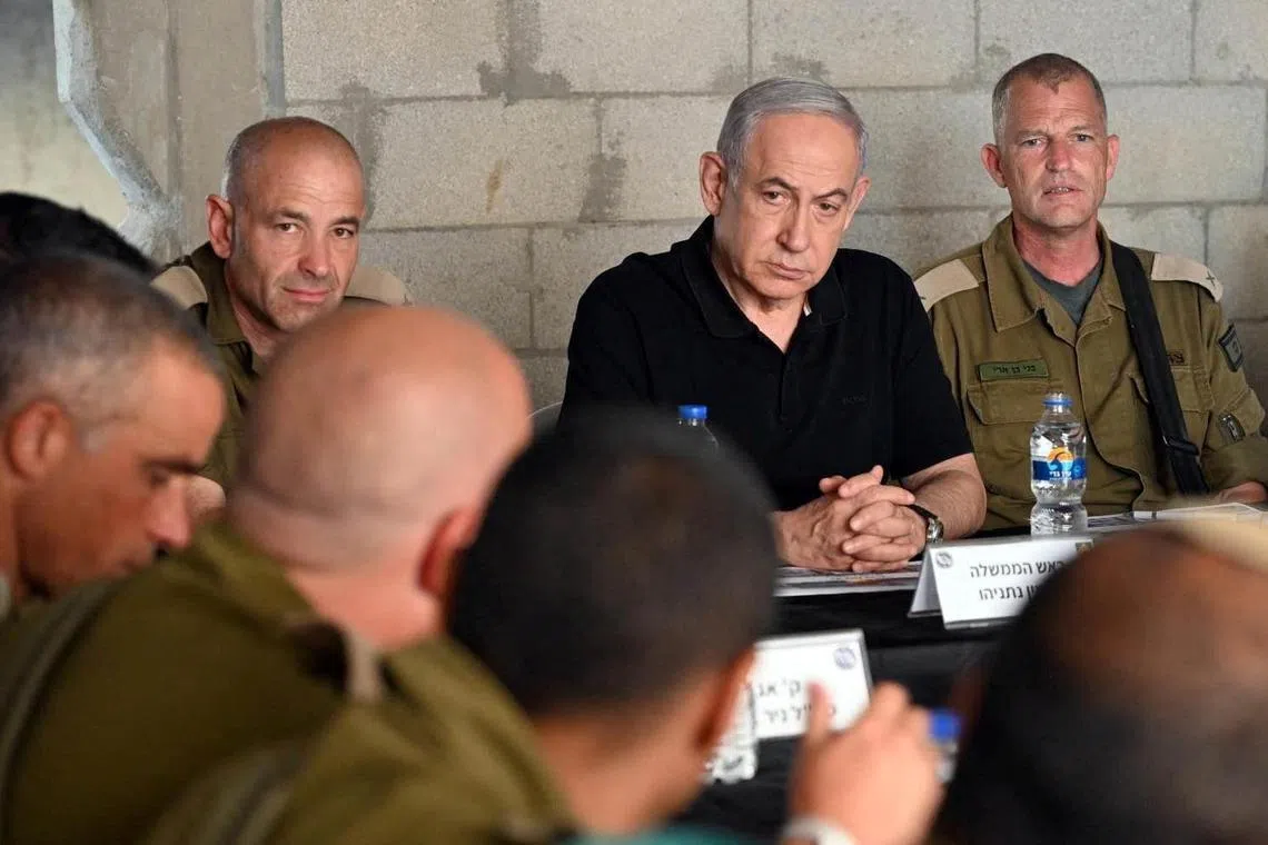 Israeli Prime Minister Benjamin Netanyahu meets soldiers at an army base in Tze'elim, Israel.