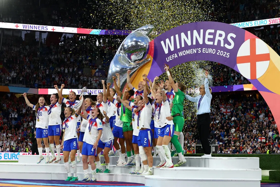 Soccer Football - UEFA Women's Euro 2025 - Final - England v Spain - St. Jakob-Park, Basel, Switzerland - July 27, 2025 England's Leah Williamson and Keira Walsh lift the trophy as they celebrate with teammates after winning the UEFA Women's Euro 2025 REUTERS/Bernadett Szabo