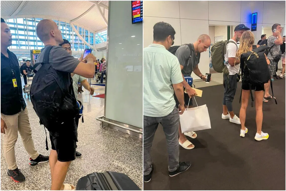 Bali immigration officers escort Russian national Yuri Chilikin  at the Denpasar airport in Bali during his deportation process.