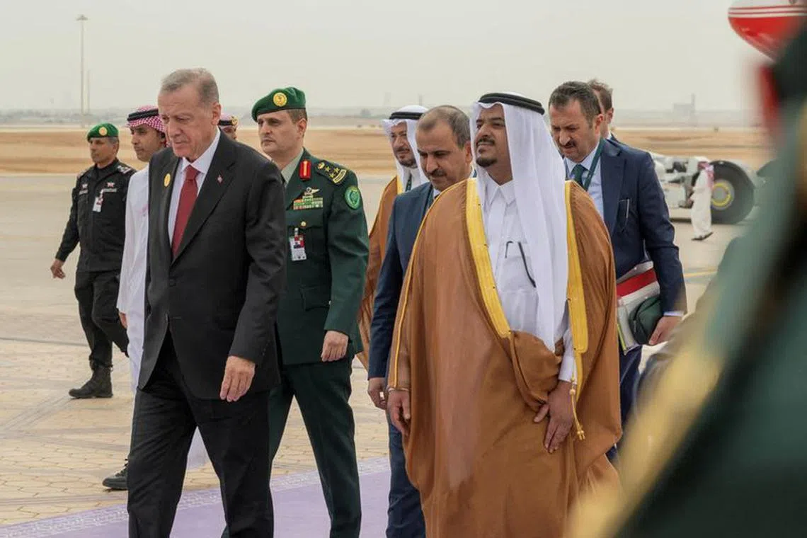 Turkey's President Tayyip Erdogan arrives to attend Organisation of Islamic Cooperation (OIC) summit in Riyadh, Saudi Arabia, November, 11, 2023. Saudi Press Agency/Handout via REUTERS