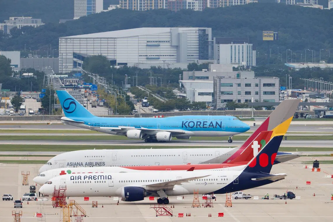 A chartered plane transporting South Korean workers who were detained in a huge immigration raid last week at the site of a U.S. car battery project involving Hyundai Motor and LG Energy Solution in the U.S. state of Georgia, arrives at the Incheon International Airport in Incheon, South Korea, September 12, 2025. REUTERS/Kim Soo-hyeon