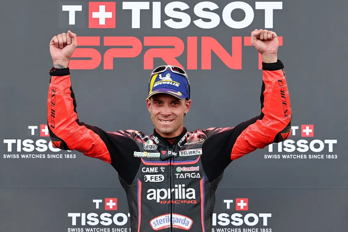 MotoGP -  Indonesian Grand Prix - Mandalika International Street Circuit, Mandalika, Indonesia - October 4, 2025 Aprilia Racing's Marco Bezzecchi celebrates after winning the sprint race REUTERS/Willy Kurniawan