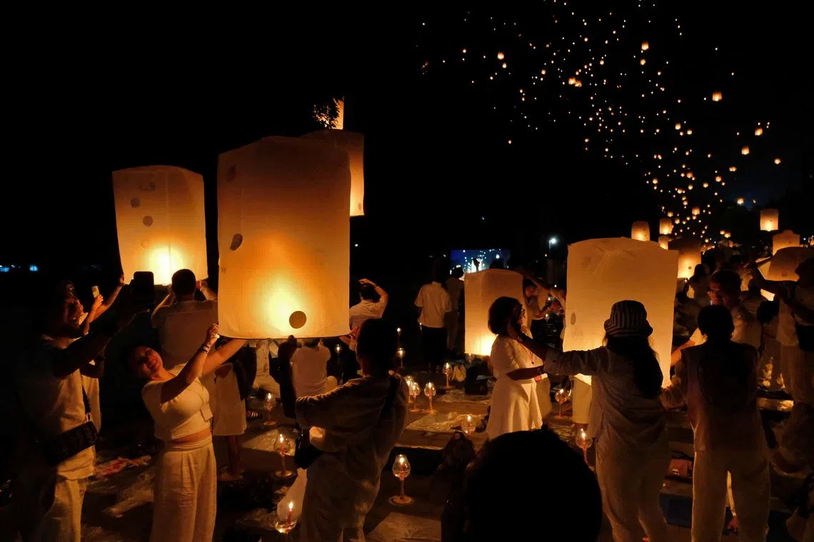 People releasing paper lanterns during celebrations marking Vesak Day at Borobudur temple area in Magelang, Central Java province, Indonesia, on May 23, 2024.
