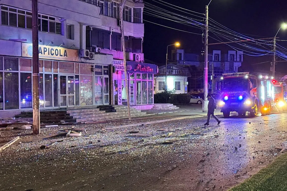 A man walks at the site of a explosion at a residential block of flats following a drone hit close to the border with Ukraine, in Galati, Romania, May 29, 2026. Inquam Photos via REUTERS