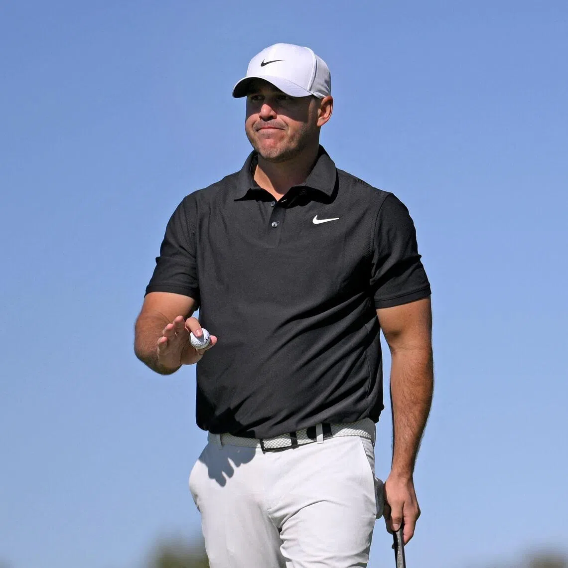 Brooks Koepka of the United States reacts to his putt on the tenth green during the first round of the Farmers Insurance Open.