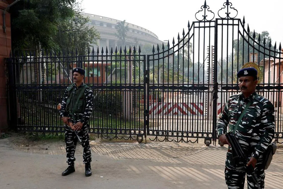 FILE PHOTO: Security force personnel stand guard outside the parliament premises after a man jumped into the lawmakers' area of the lower house of India's parliament, in New Delhi, India, December 13, 2023. REUTERS/Sahiba Chawdhary/File Photo