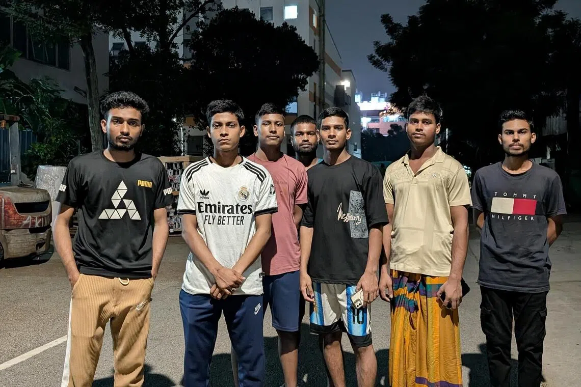Bangladeshi workers from Process Maintenance Solutions and Jurong Technical & Construction outside their dormitories in Tuas on Oct 24.