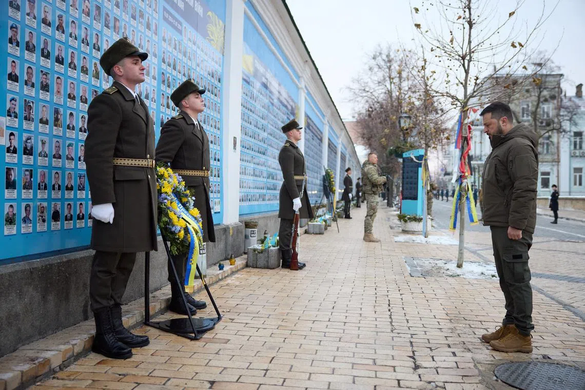 Ukraine's President Volodymyr Zelenskiy visits the Memory Wall of Fallen Defenders of Ukraine on Day of the Ukrainian Armed Forces, amid Russia's attack on Ukraine, in Kyiv, Ukraine December 6, 2023.  Ukrainian Presidential Press Service/Handout via REUTERS/File Photo