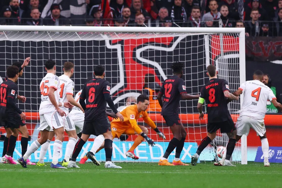 Soccer Football - Bundesliga - Bayer Leverkusen v Bayern Munich - BayArena, Leverkusen, Germany - March 14, 2026 Bayern Munich's Jonathan Tah scores a goal before it was disallowed following a VAR review REUTERS/Thilo Schmuelgen