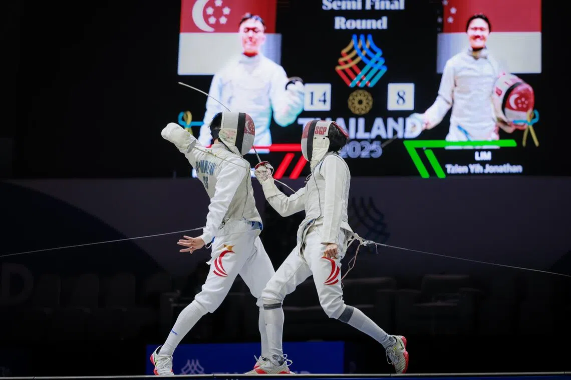 Raphael Tan (left) beat teammate Jonathan Lim in the men's individual foil semi-final before going on to win gold.