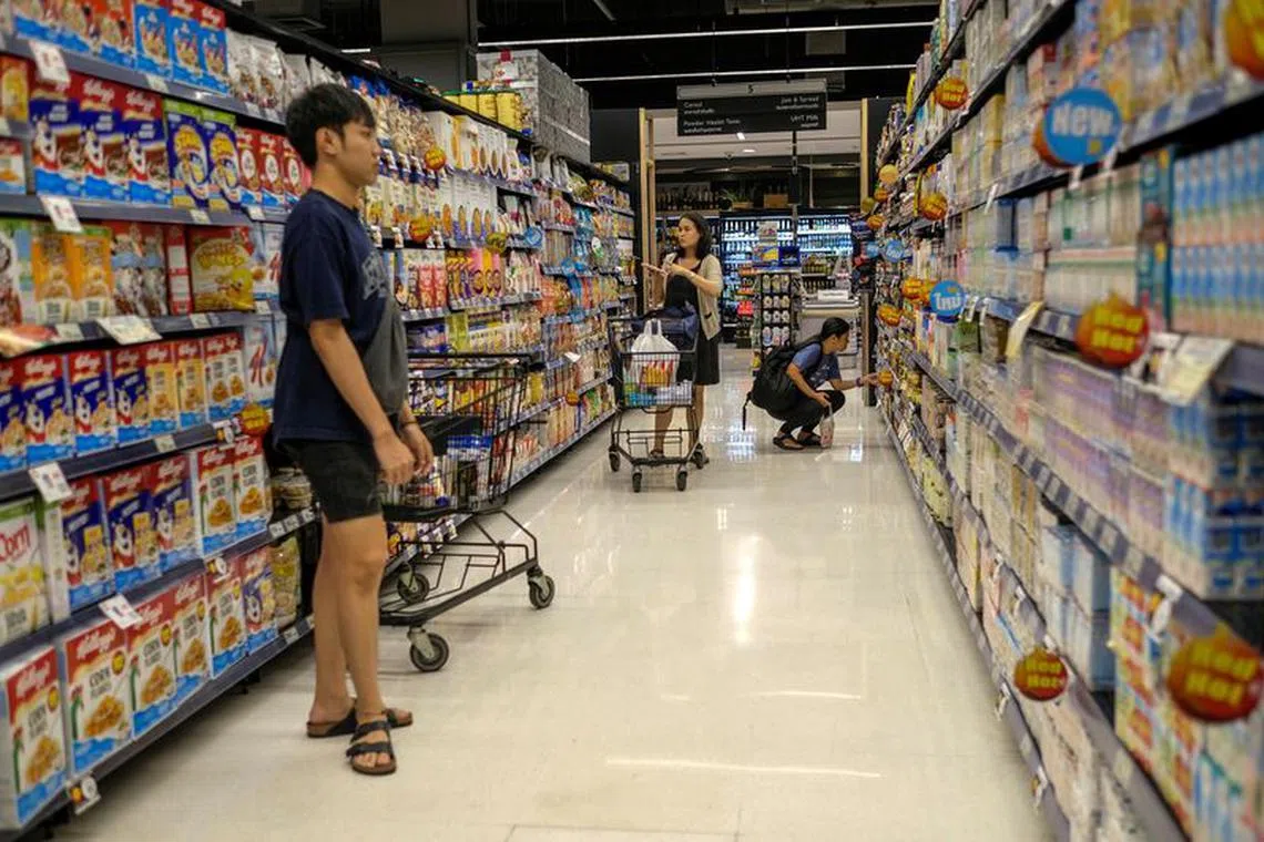 People shop at a supermarket inside a department store in central Bangkok, Thailand, December 28, 2016. Picture taken December 28, 2016. REUTERS/Athit Perawongmetha/file photo