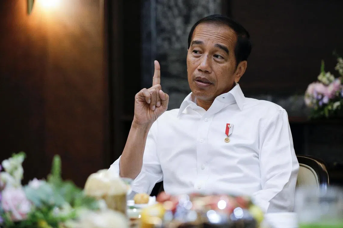Indonesian President Joko Widodo gestures as he talks during an interview at the Presidential Palace in Jakarta, Indonesia, February 1, 2023. REUTERS/Willy Kurniawan