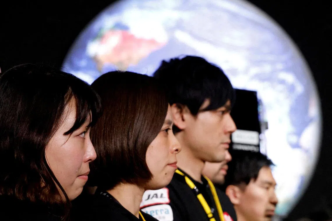 Employees of Japanese start-up ispace react after losing contact with their Hakuto-R moon lander on April 26, 2023.