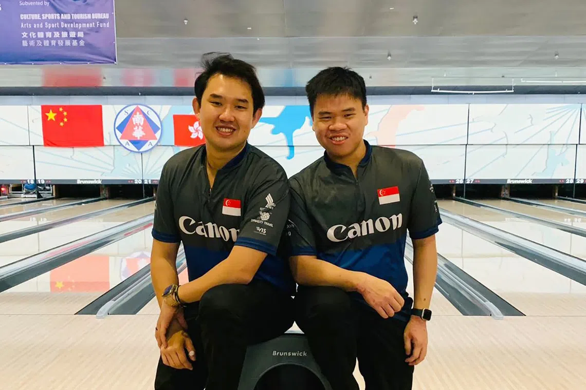 National bowlers Muhammad Jaris Goh (left) and Timothy Tham won the men's doubles at the 26th Asian Tenpin Bowling Championships in Hong Kong.