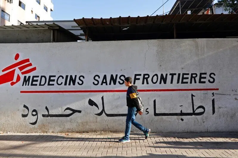 A Palestinian boy walks past the clinic of Doctors Without Borders or Medecins Sans Frontieres (MSF), in the al-Rimal neighbourhood of Gaza City.