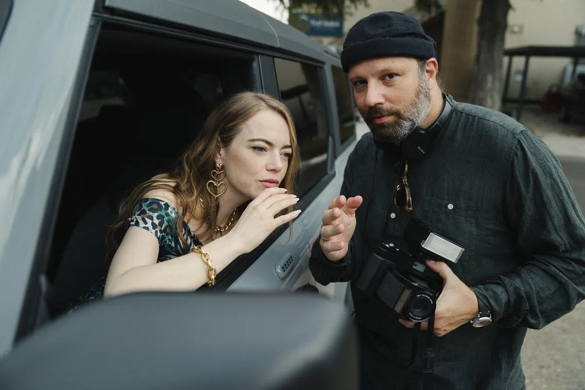 Emma Stone (left) and Yorgos Lanthimos on the set of Kinds Of Kindness. 