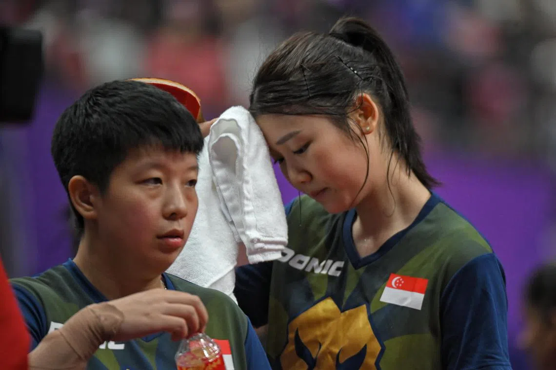 Singapore's Zeng Jian (left) and Wong Xin Ru will have to regroup and refocus for Paris 2024 individual event qualification after the Republic missed out on the Olympic table tennis women's team event qualification for the first time.