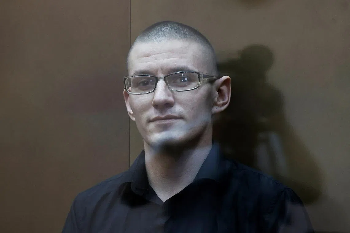 U.S. citizen Robert Woodland, arrested on suspicion of drug trafficking, sits behind a glass wall of an enclosure for defendants before a court hearing in Moscow, Russia May 30, 2024. REUTERS/Maxim Shemetov/File Photo