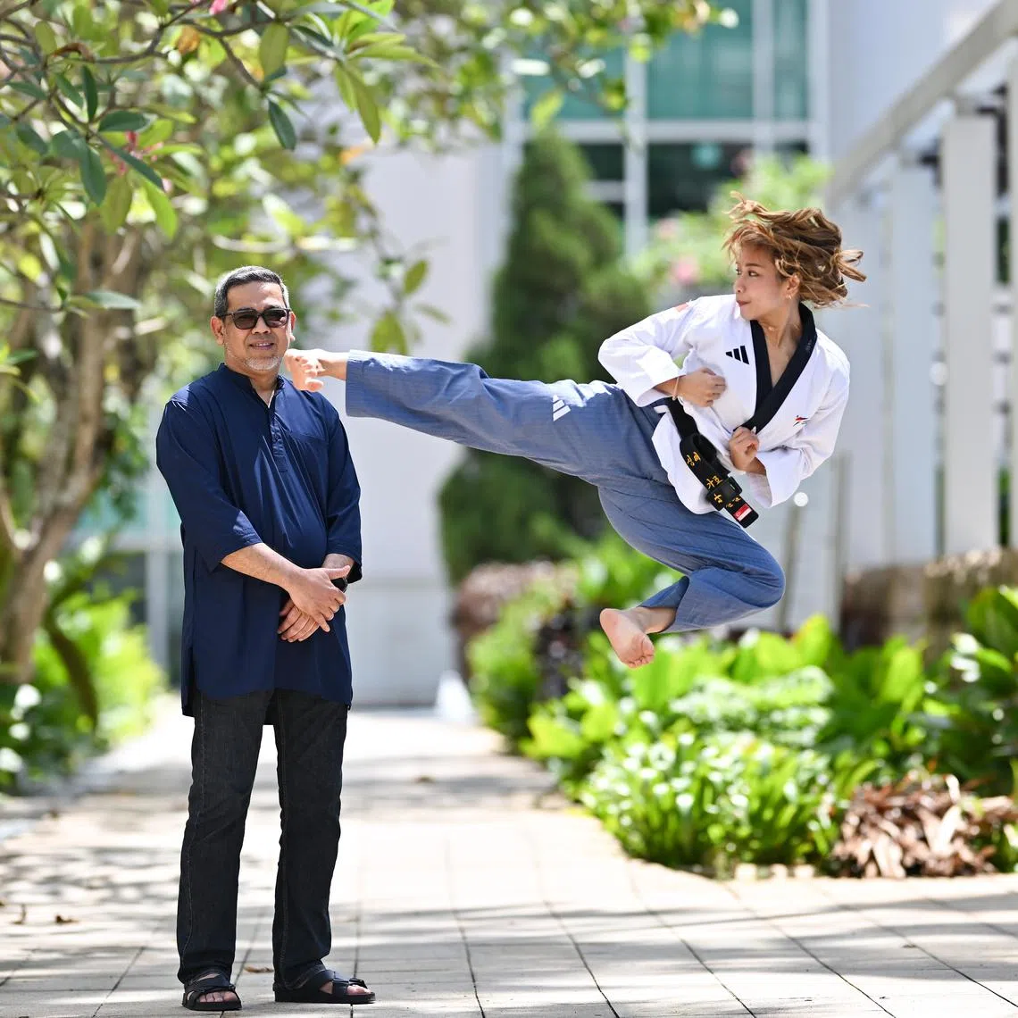 National taekwondo athelete Diyanah Aqidah Muhammad Dian Khudhairi, 26, has grown closer to her father, Muhammad Dian Khudhairi Bin Mohamed Ali, 52, since her mother's death in 2015. ST PHOTO: LIM YAOHUI