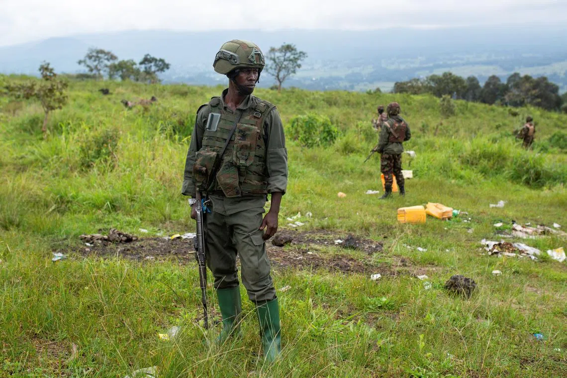 FILE PHOTO: Congolese M23 rebels are seen before withdrawing from the 3 antennes location in Kibumba, near Goma, North Kivu province of the Democratic Republic of Congo, December 23, 2022. REUTERS/Arlette Bashizi/File Photo