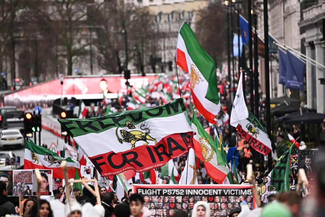 Demonstrators take part in an Iran solidarity rally in London meant to denounce the execution of pro-democracy protesters.
