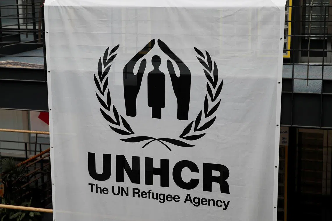 A logo is pictured on a banner at the UNHCR headquarters in Geneva, Switzerland June 13, 2018. REUTERS/Denis Balibouse/File Photo