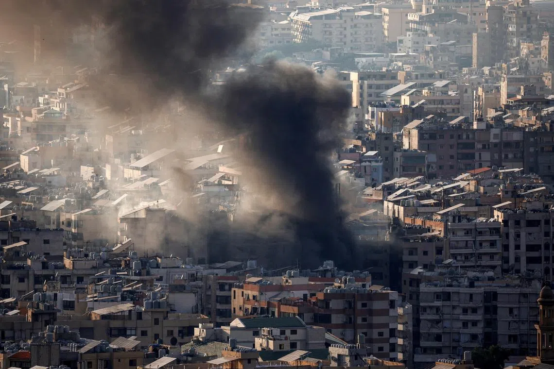 Smoke rises over Beirut's southern suburbs as Israeli strikes hit UN peacekeepers' main base on Oct 12.