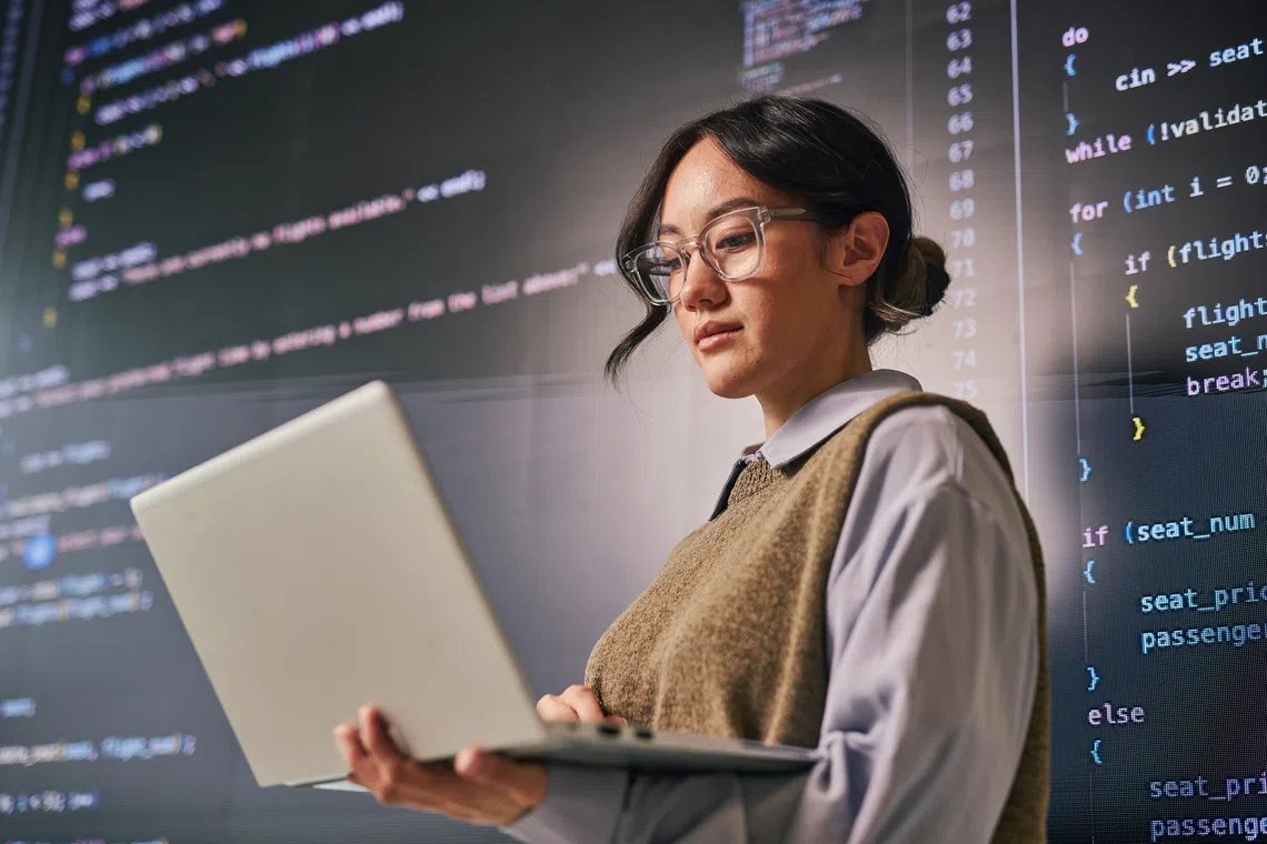 developer reviewing code and automating routine work with tools powered by artificial intelligence, agentic ai
