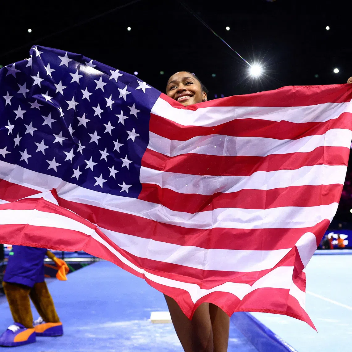 American gymnast Skye Blakely celebrates winning the women’s all around world title.